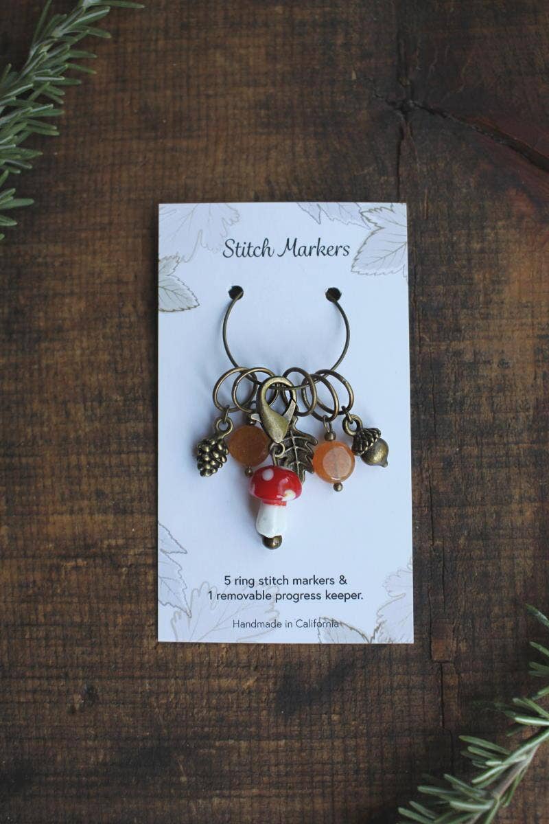 Mushroom and acorn stitch markers.