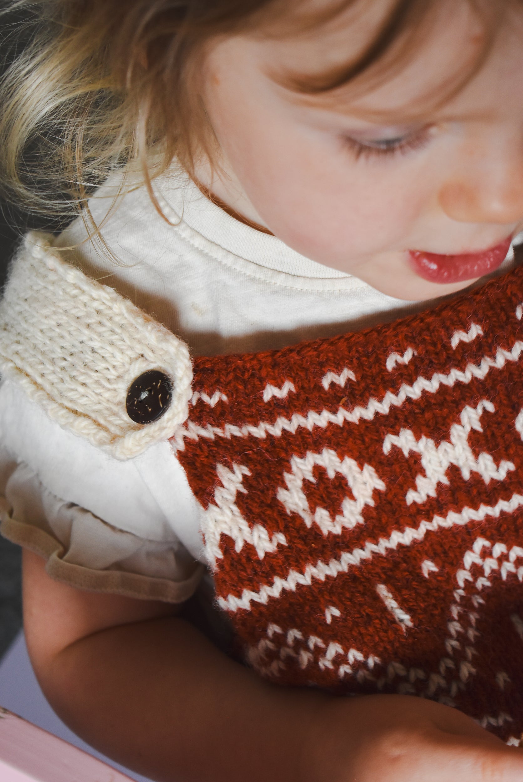 Patterned Christmas dress knitting pattern for toddler girls.