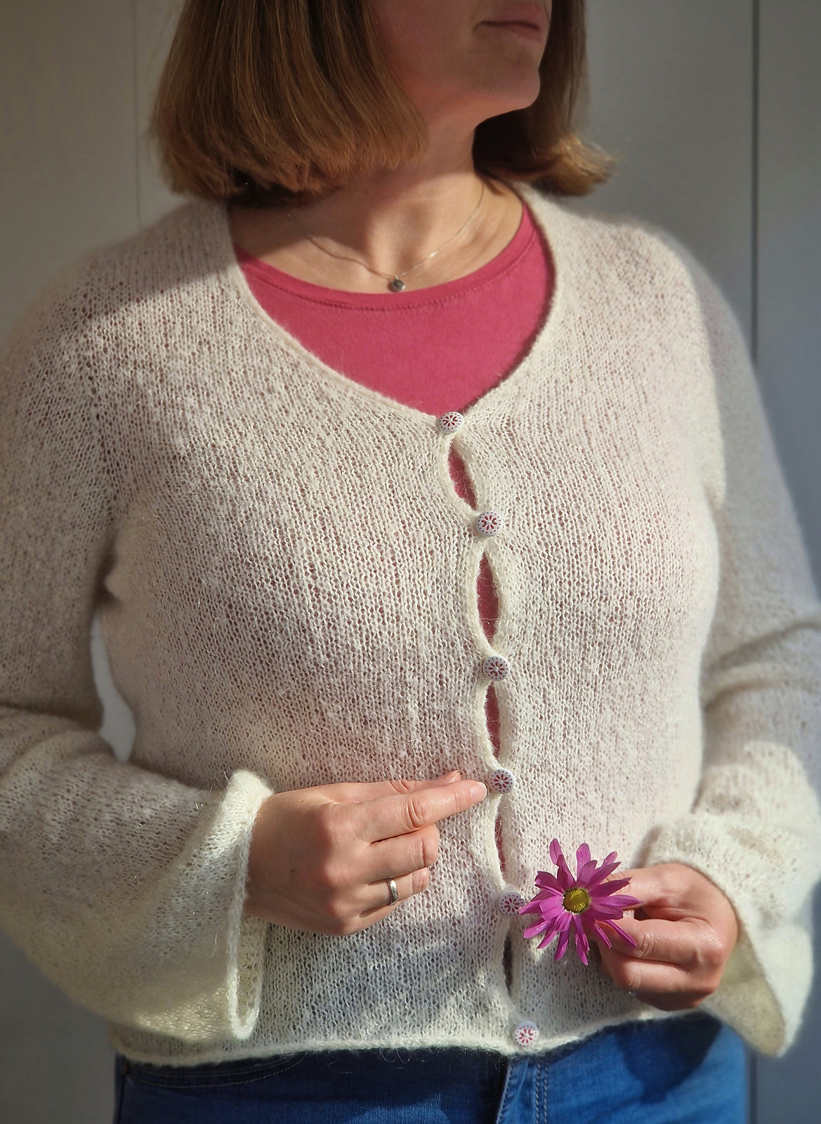 Woman wearing the Cloud Cardigan knitted cardigan.