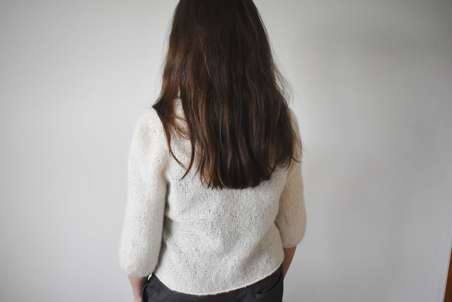 Backside of the Cloud Cardigan knitting pattern for women.