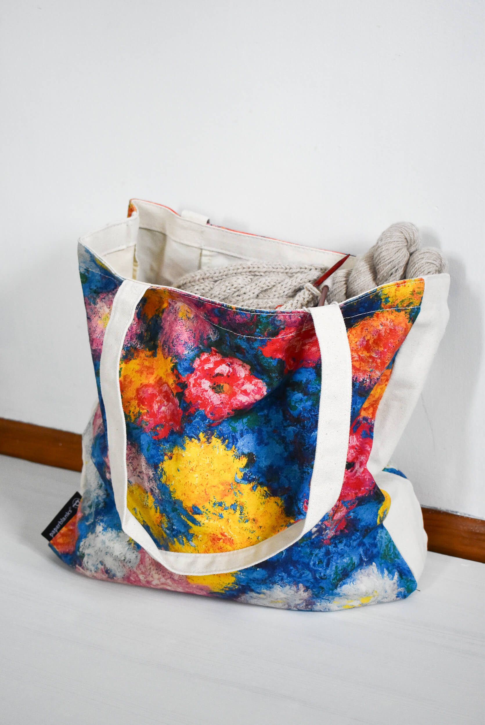 Large and colorful canvas knitting bag.