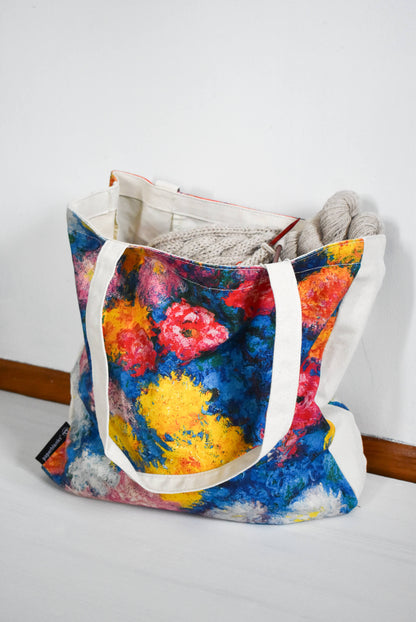 Large and colorful canvas knitting bag.