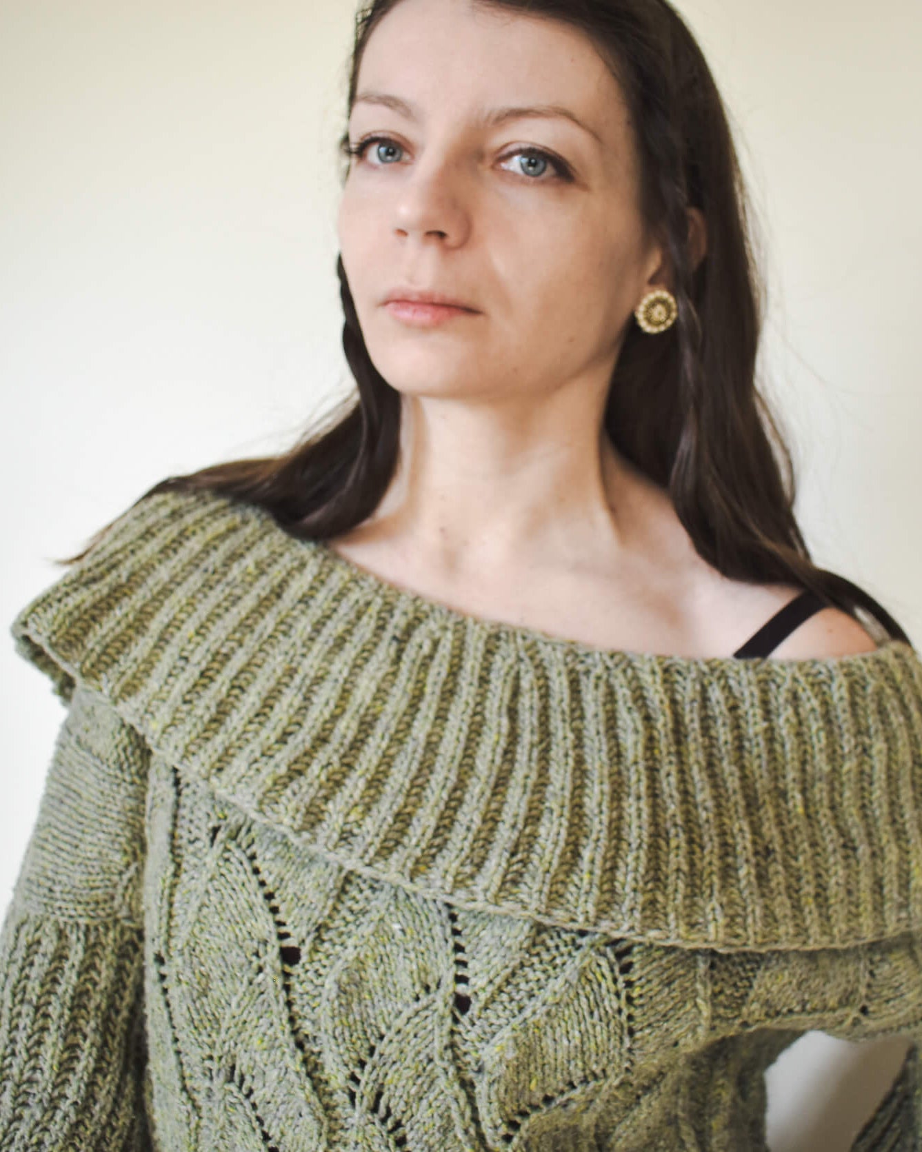 Green cowl pullover knitting pattern for women.