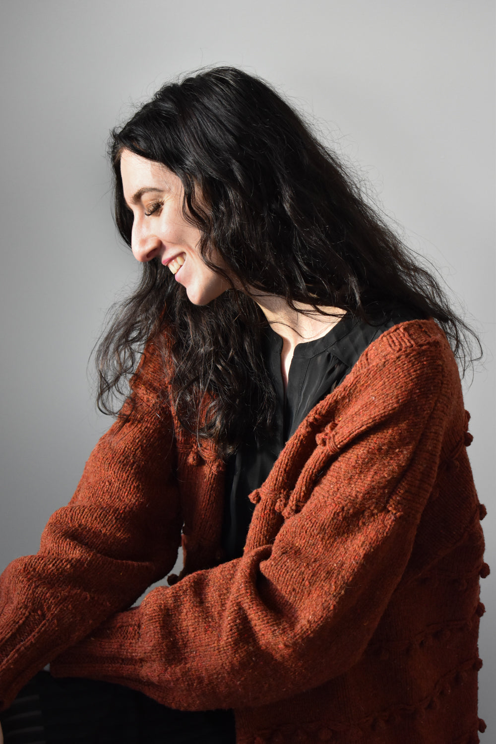 Oversized cardigan knitting pattern featuring bobbles and slipped stitches.