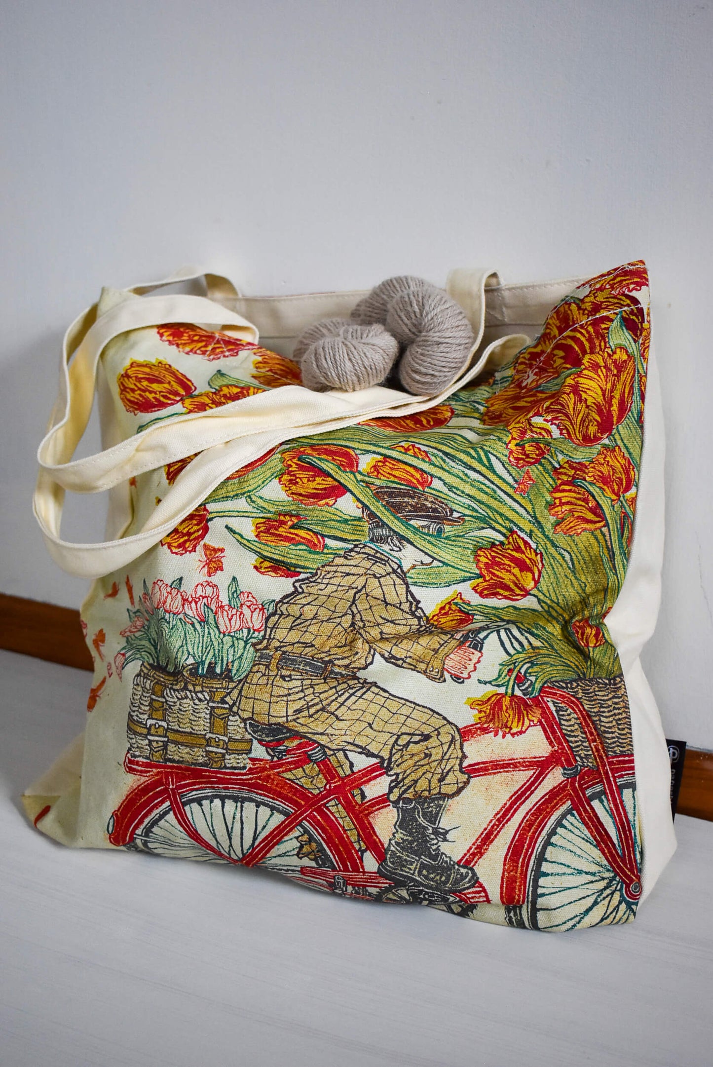 Project tote with a person riding a bike.