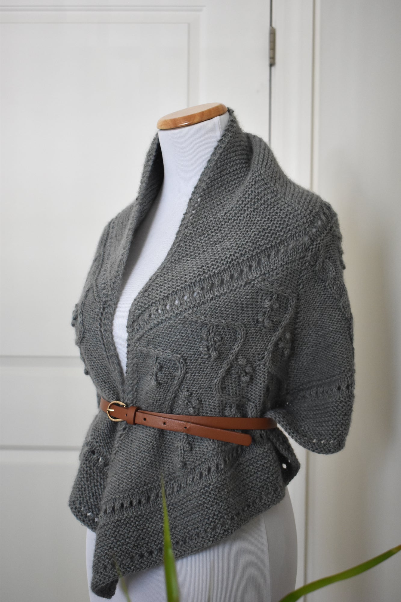 Lady of the Lake shawl knitting pattern, shown with a brown belt around waist.