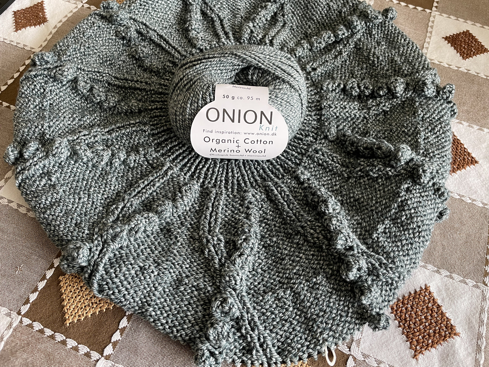 Seaweed Pullover knitting pattern yoke in progress, worked with organic cotton yarn by Onion.