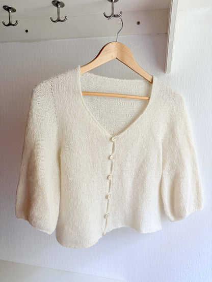 White cardigan knitting pattern for transitional weather.