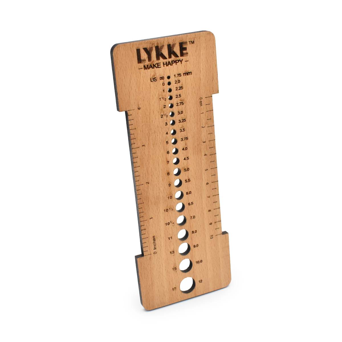 Wooden knitting needle and swatch gauge by Lykke.