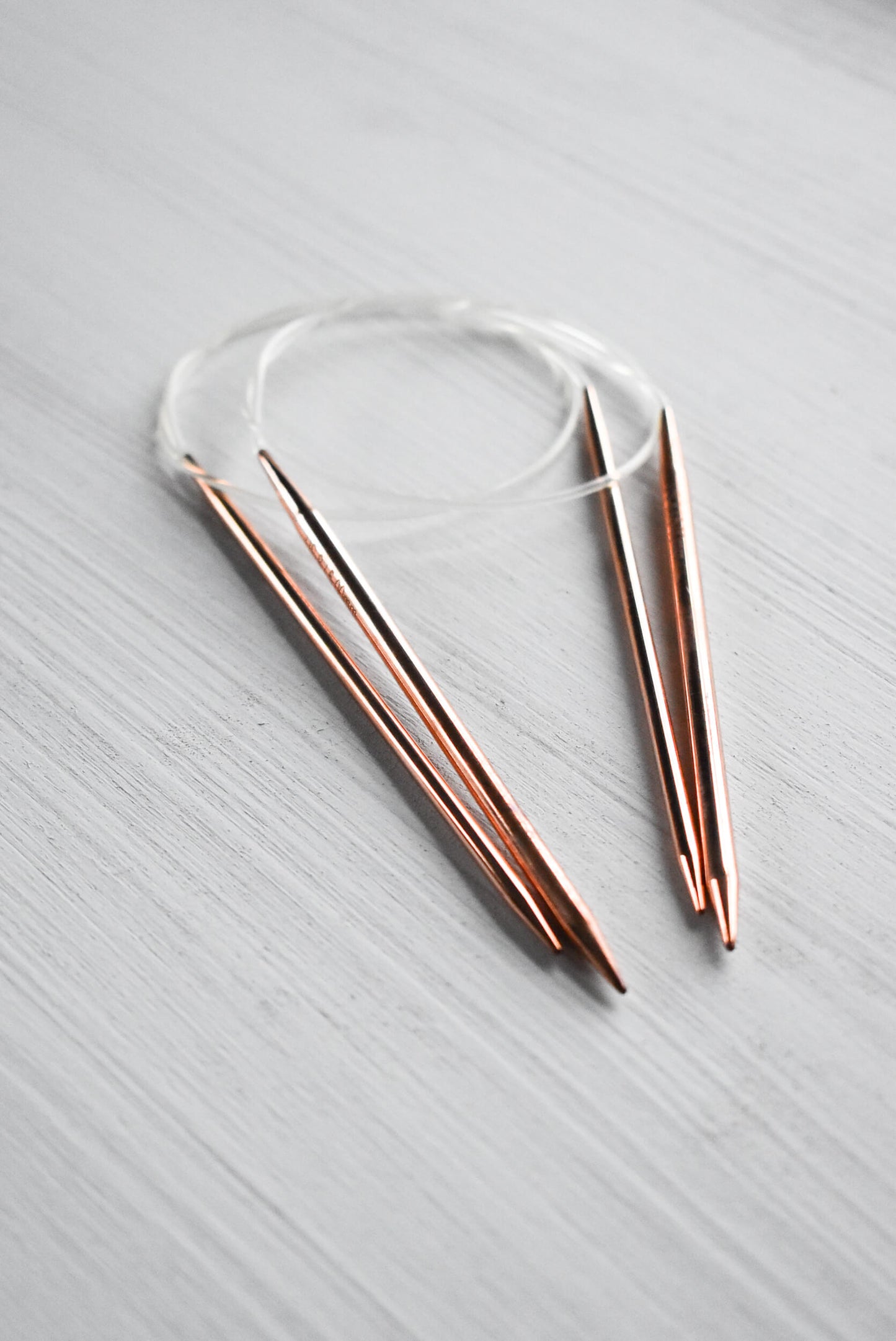Circular copper knitting needles by Lykke.
