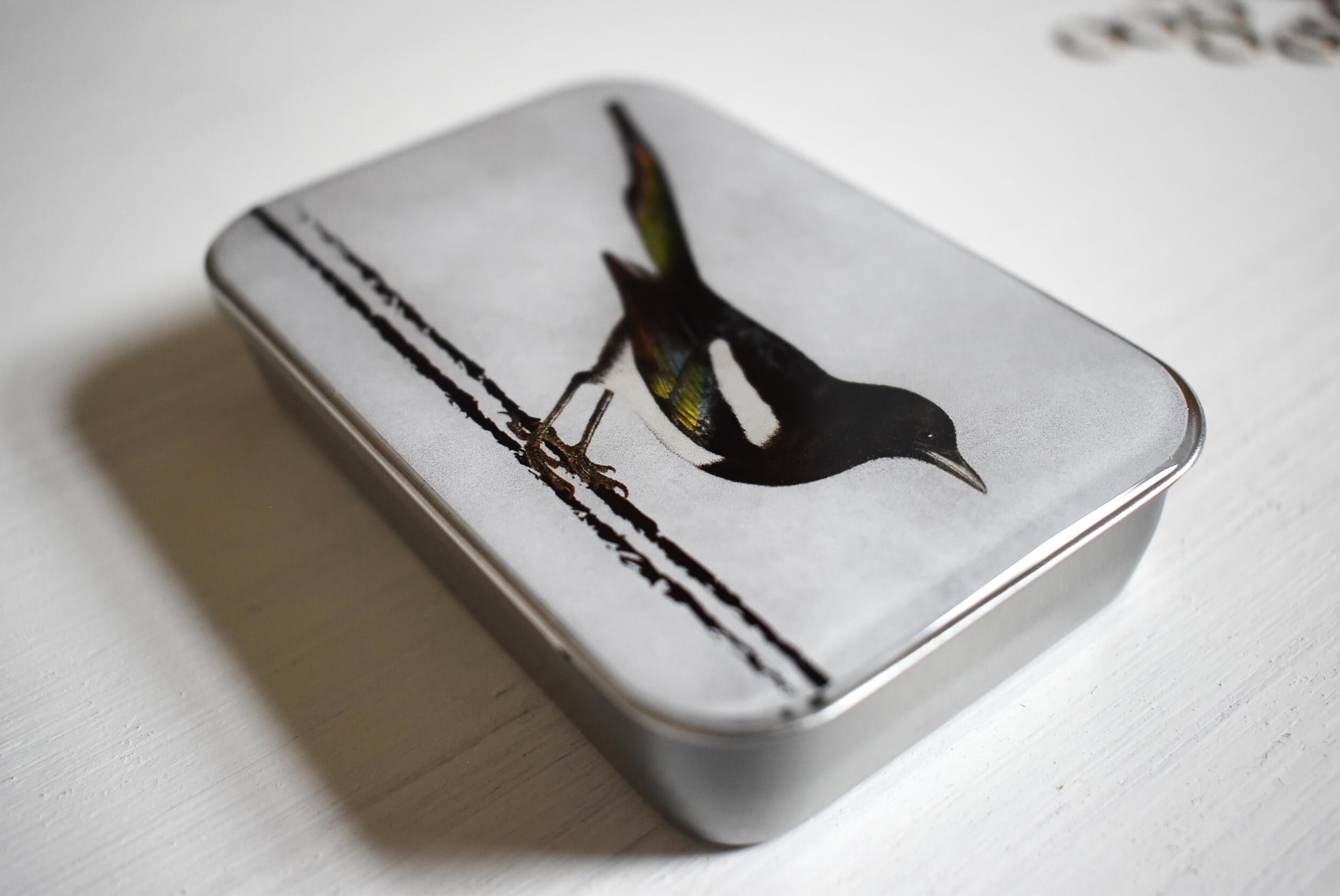 Detail of the handmade knitting notions tin.