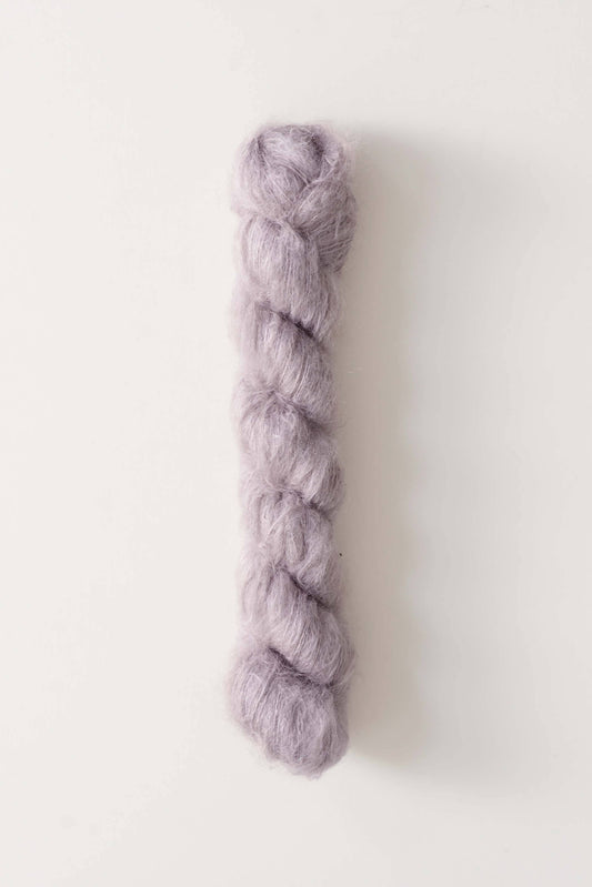 Silk mohair yarn by Quince & Co. in mauve color.