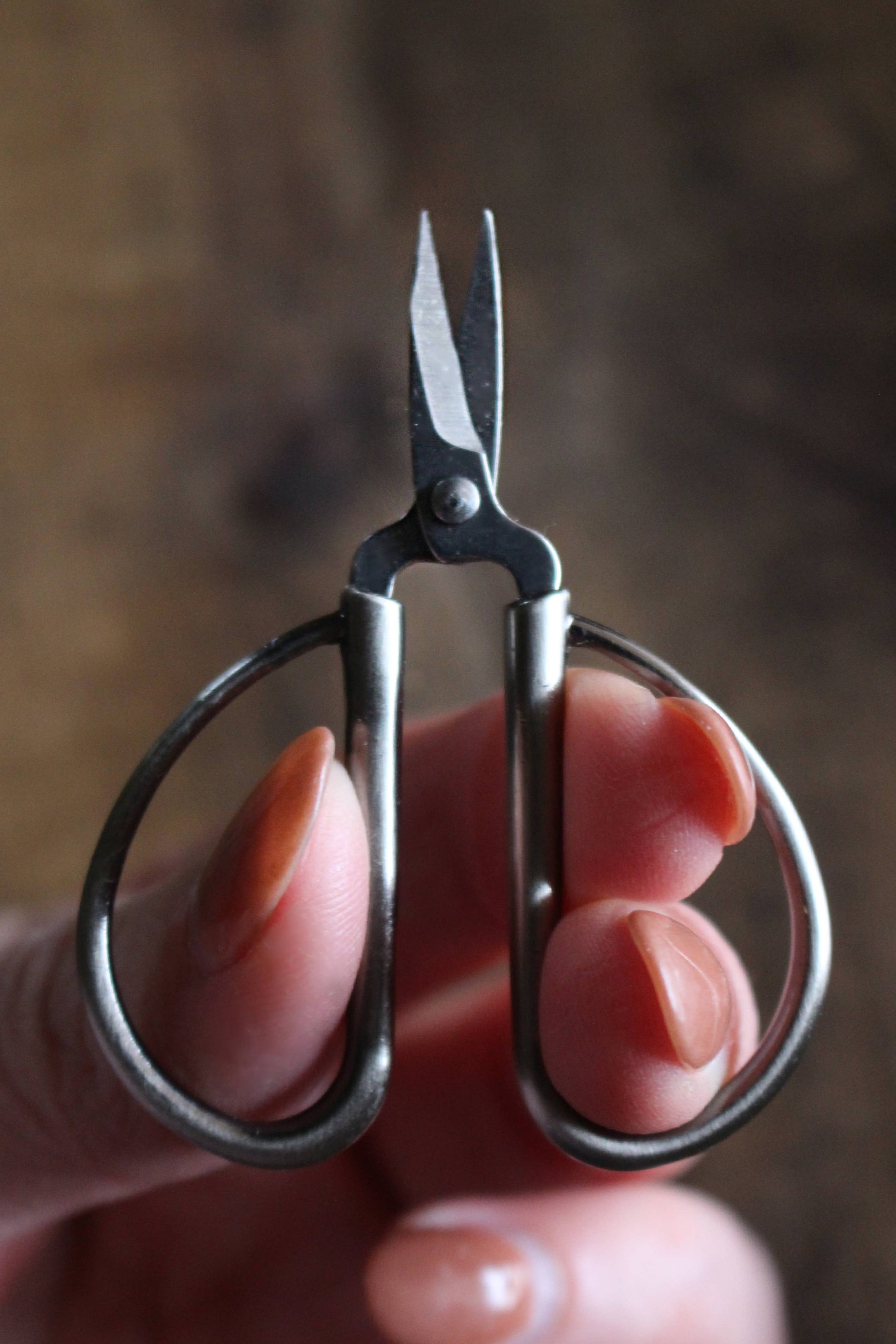Small scissors in antique silver.