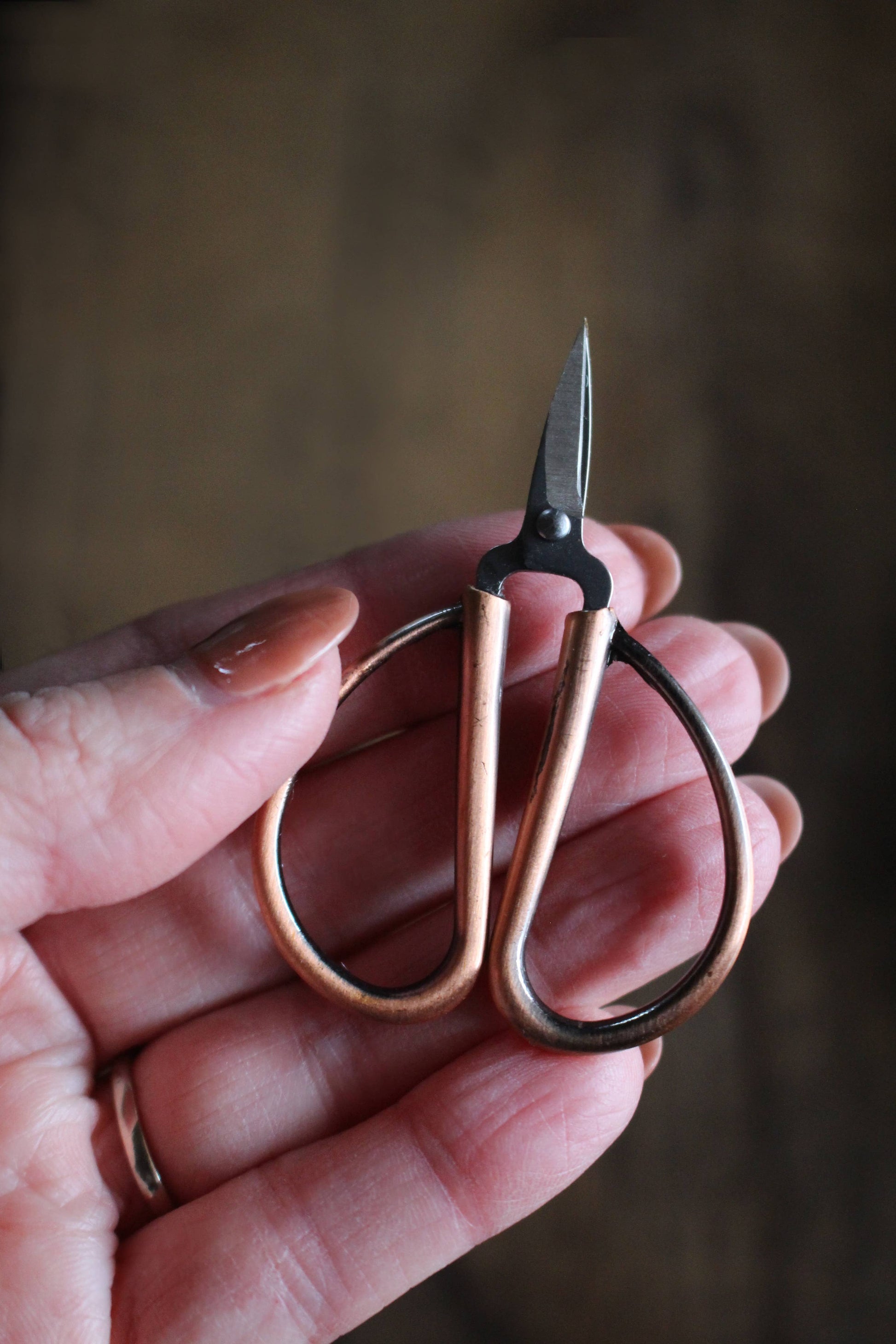 Mini bonsai scissors for knitters.