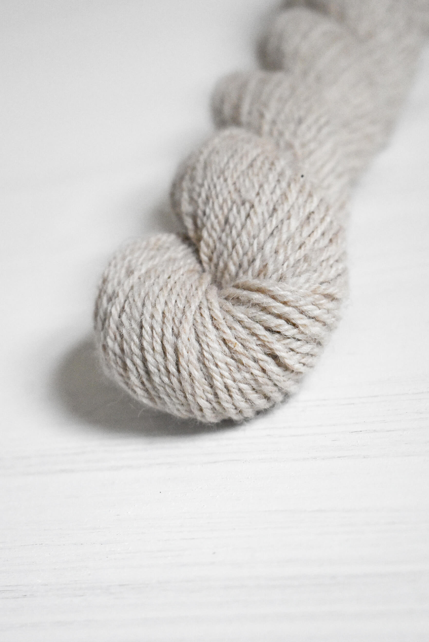 Skein of gray wool and baby alpaca yarn.