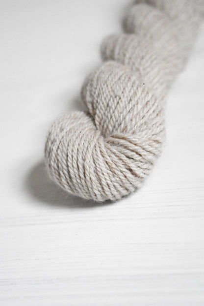 Skein of gray wool and baby alpaca yarn.