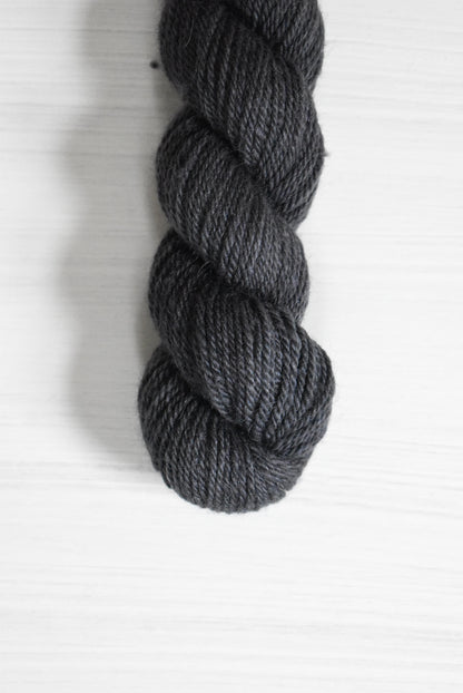 Navy blue skein of baby alpaca wool yarn.