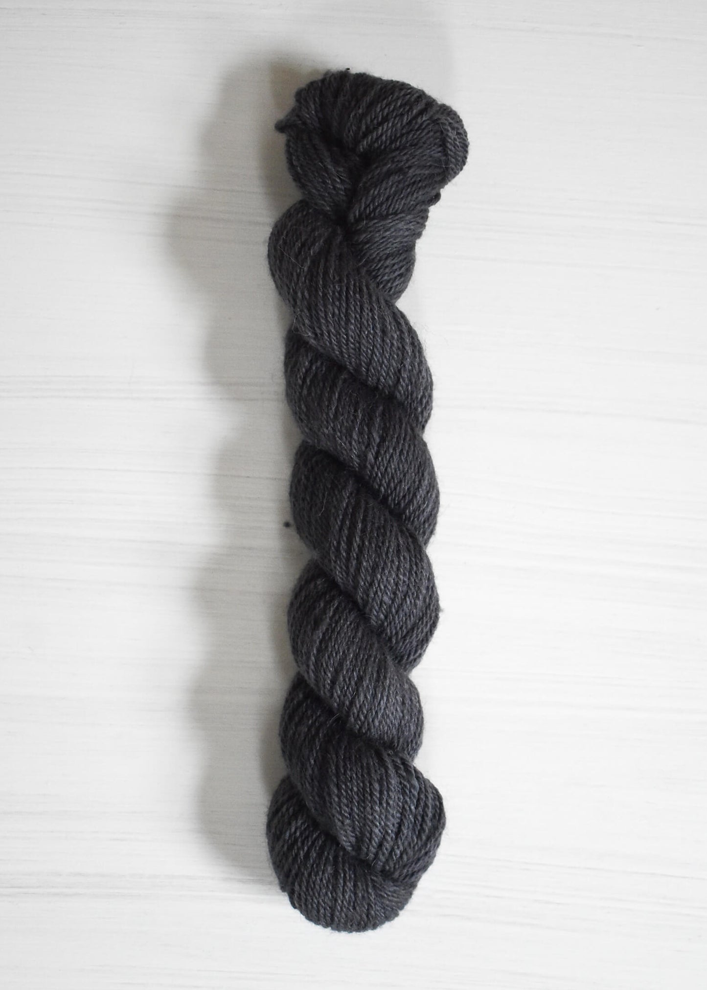 DK weight wool and alpaca yarn in navy blue.