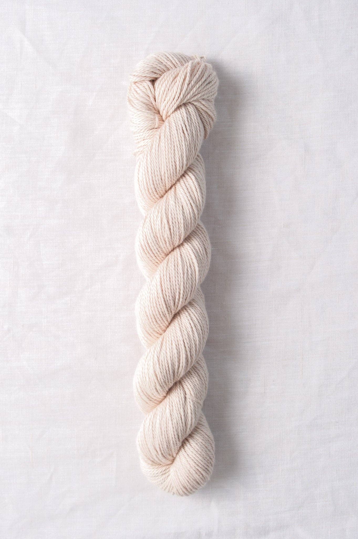 Cream-colored skein of Willet 100% organic cotton yarn by Quince & Co.