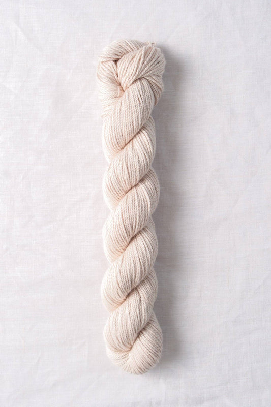 Cream-colored skein of Willet 100% organic cotton yarn by Quince & Co.