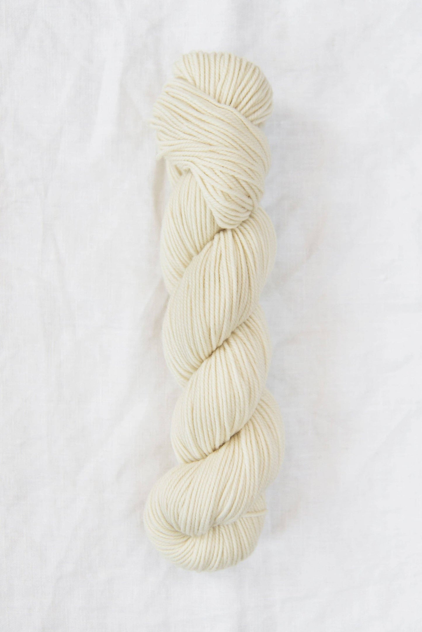 DK weight natural white yarn, 100% American wool.