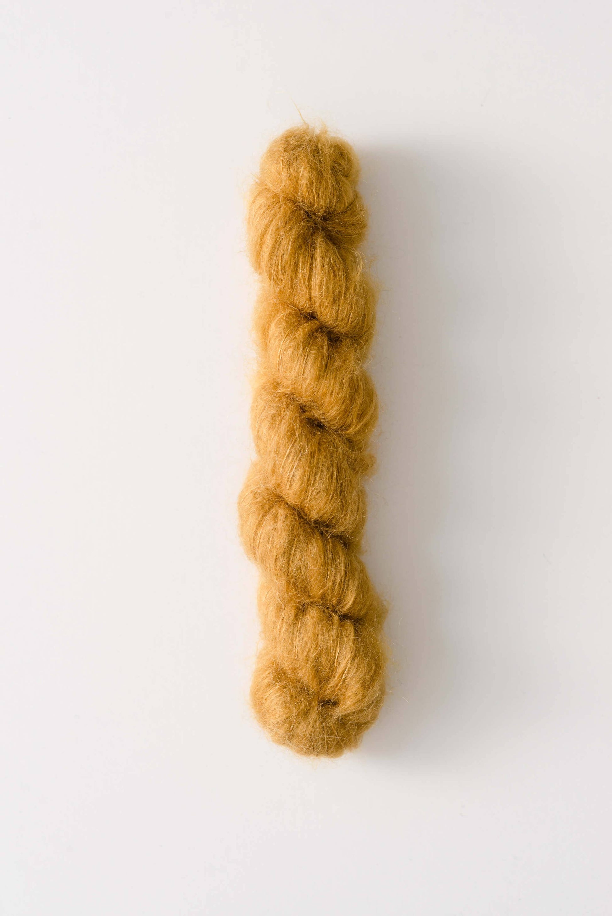 Lace-weight mustard yellow silk mohair yarn Dove by Quince & Co
