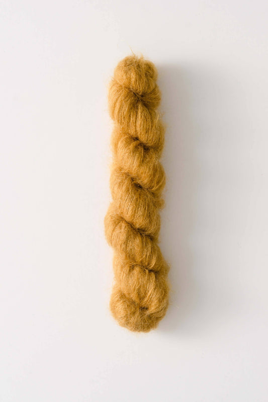 Lace-weight mustard yellow silk mohair yarn Dove by Quince & Co