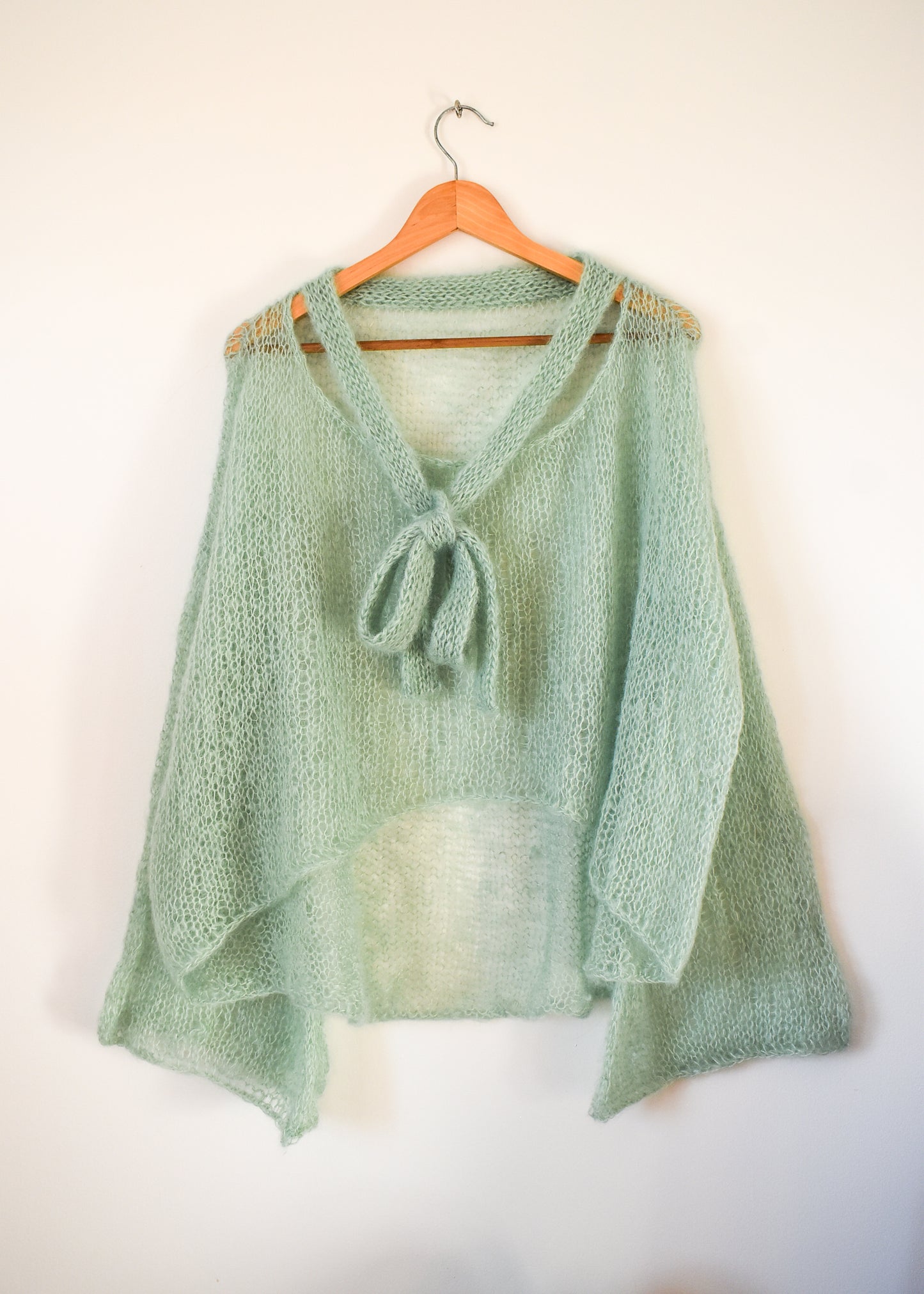 A light mint green lightweight blouse knitting pattern created with silk mohair yarn.