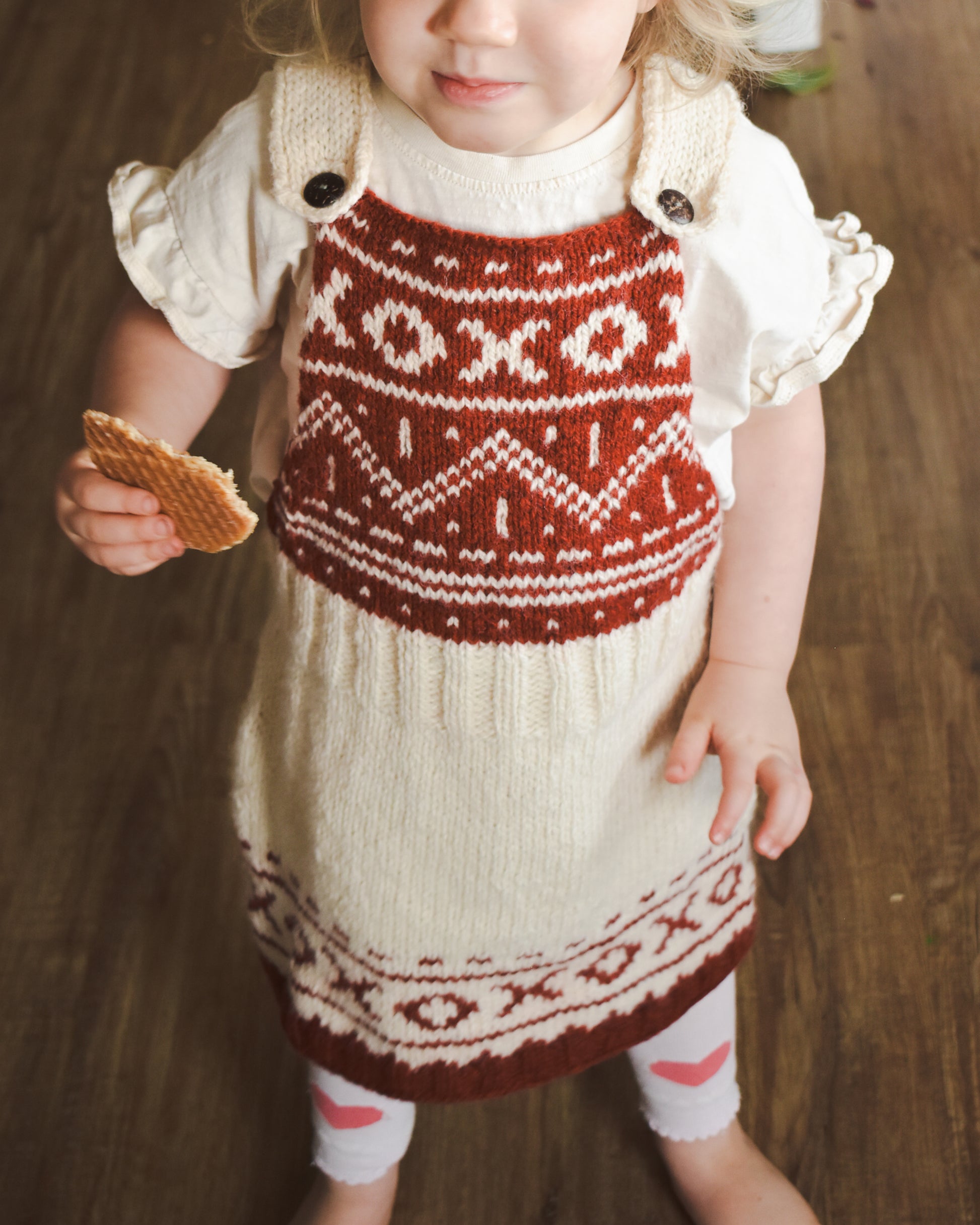 XOXO Christmas dress knitting pattern for toddlers.