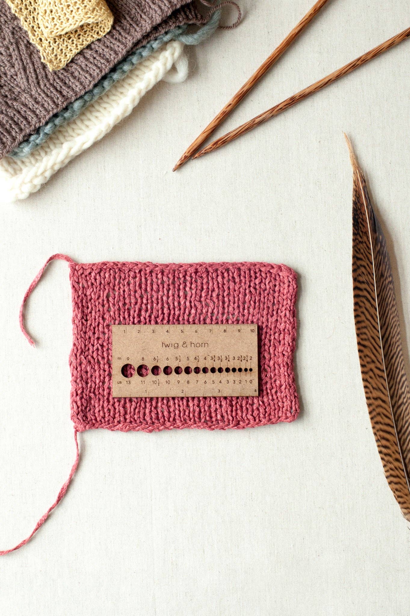 Needle and gauge ruler small enough for travel.