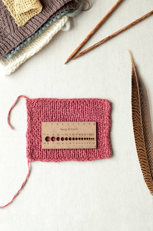 Needle and gauge ruler small enough for travel.