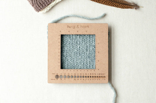 Eco-friendly knitting swatch and needle ruler.