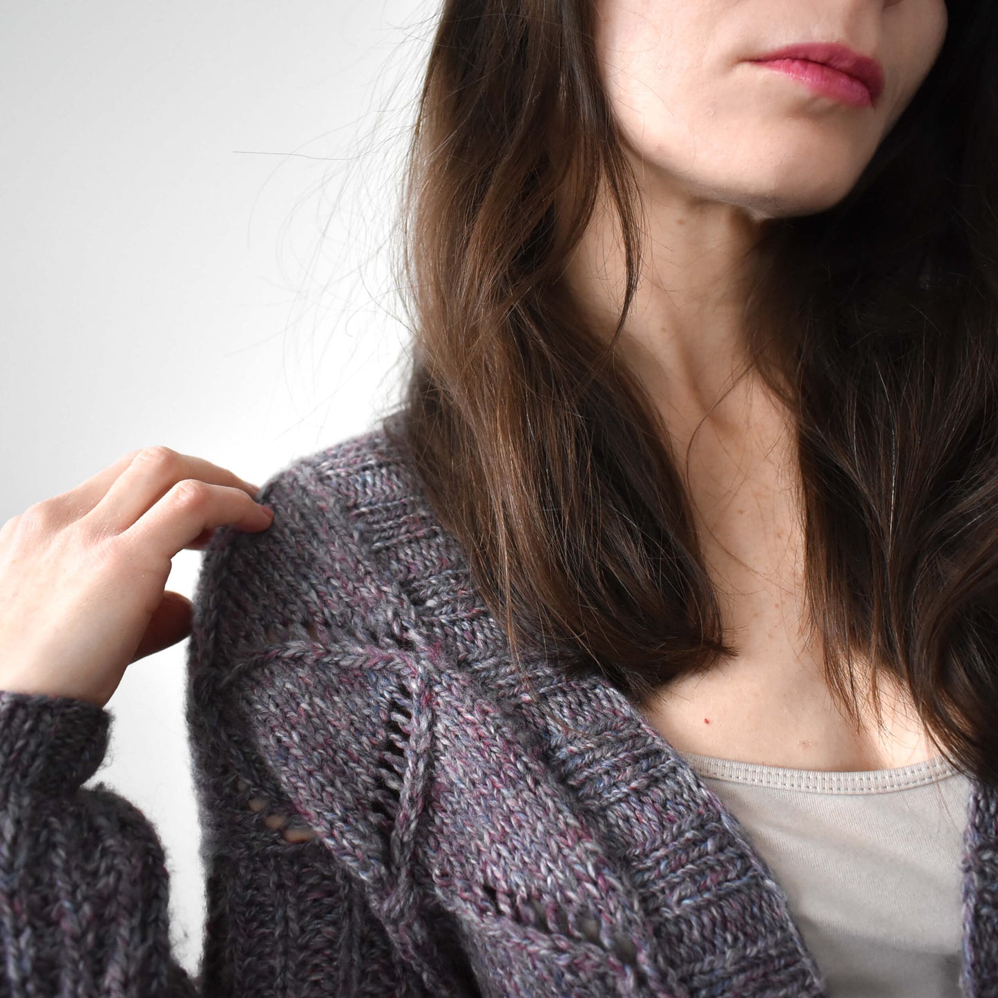Textured purple cardigan knitting pattern for women.