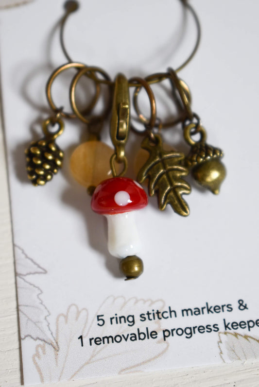 Set of stitch markers with a mushroom charm.